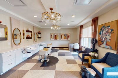 Bright beauty salon with stylish decor and seating