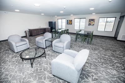 Bright common area with seating and tables