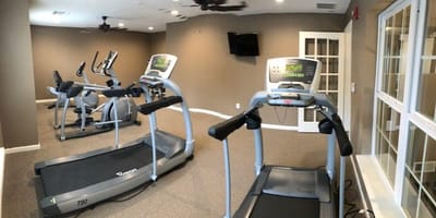 Interior view of a fitness area with exercise equipment