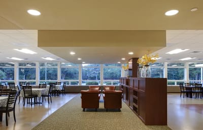 Interior of a common area with seating and windows