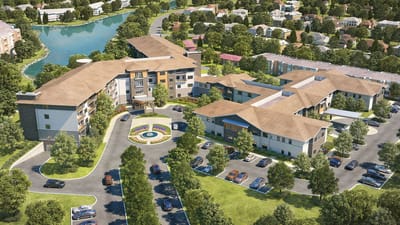 Aerial view of a senior living facility with landscaping