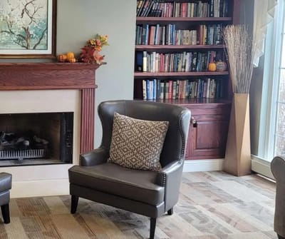 Cozy seating area with bookshelves and decor