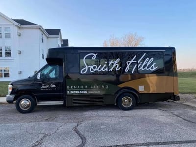 Facility transport van with South Hills branding