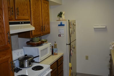 Kitchen area with appliances and cabinets