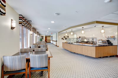 Interior dining area with seating and food display