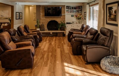 Cozy common area with recliners and a fireplace