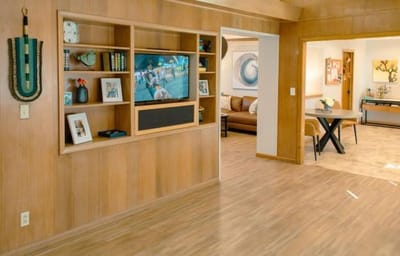 Bright common area with a TV and seating