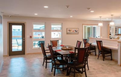 Bright dining area with tables and chairs