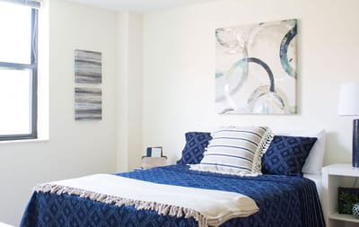 Cozy private resident room with bedding and decor