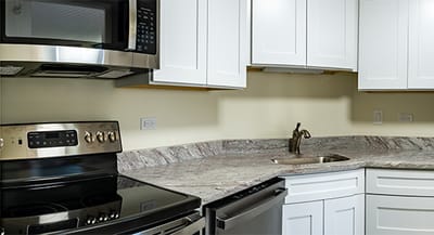 A clean kitchen area with modern appliances