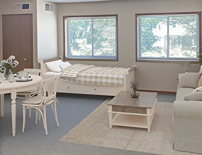 Cozy resident room with bed and seating area
