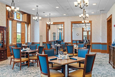 Dining room with tables and chairs set for a meal