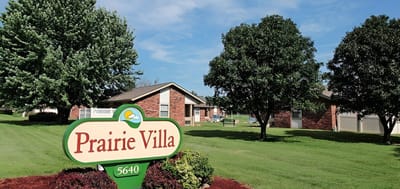 Prairie Villa facility signage with green landscaping