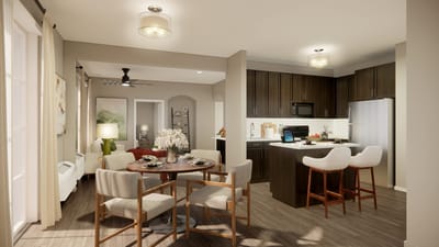 Bright, modern kitchen and dining area in a senior living apartment