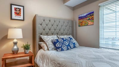Cozy bedroom with decorative elements and a lamp