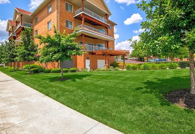 Exterior view of the facility with landscaped lawn