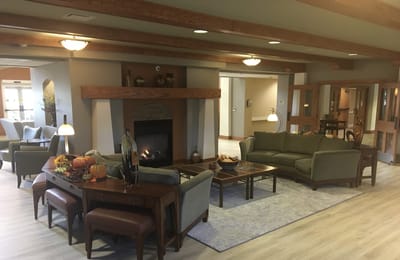 Cozy common area with seating and a fireplace