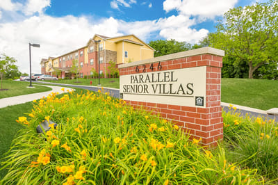 Exterior view of Parallel Senior Villas sign and building