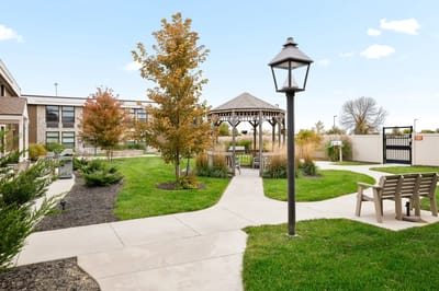 Garden area with gazebo and pathway in senior living facility