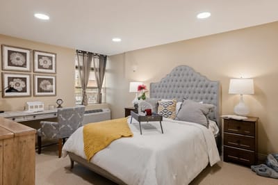 Cozy resident room with a bed and desk