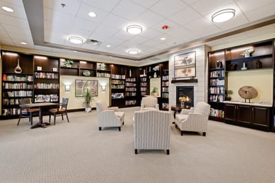 Cozy reading area with bookshelves and seating