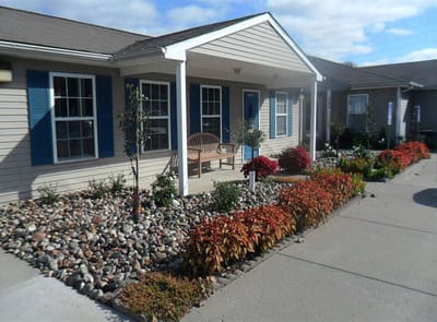 Front porch area with colorful landscaping