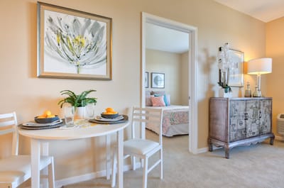 Bright interior view of a resident room with dining table