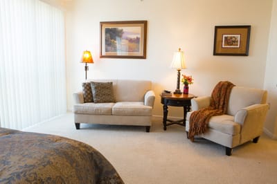 Cozy lounge area with seating and artwork