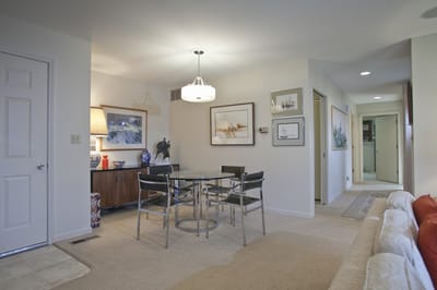 Bright and inviting common area with table and chairs