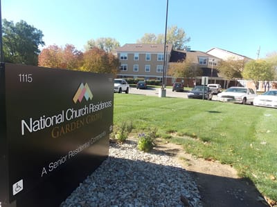 Exterior view of Garden Grove Apartments sign and facade