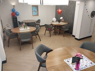 Bright common area with tables and decorations
