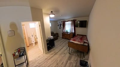 Spacious interior of a resident room with a bathroom