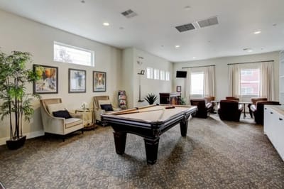 Interior common area with a pool table and seating