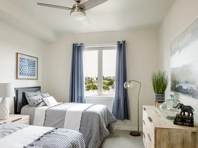 Brightly decorated standard resident room with two beds