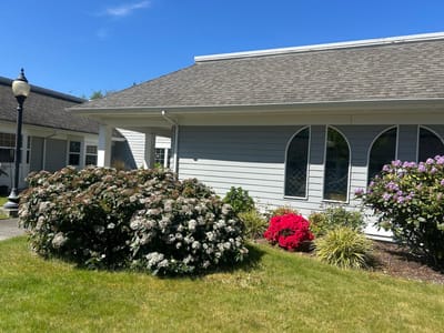 Exterior view of a senior facility with gardens