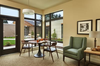 Bright interior space with a table and chairs