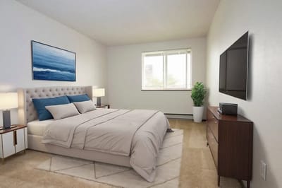 A well-furnished and bright bedroom in a senior apartment