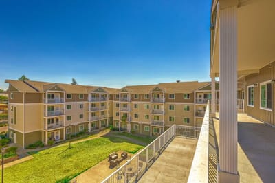 View of a senior living facility with outdoor space