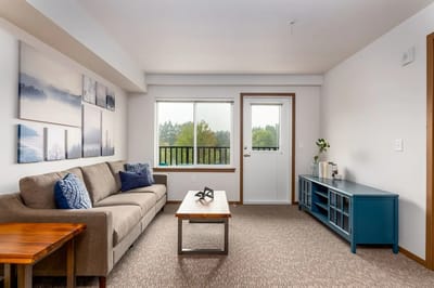Bright living area with a view of outdoor space