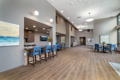 Bright common area with seating and artwork