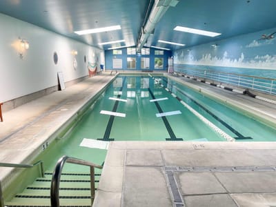 Indoor swimming pool with serene blue decor