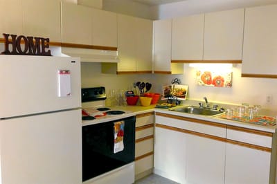 Bright kitchen area with 'HOME' decoration