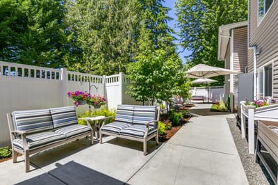 Outdoor seating area with lush greenery