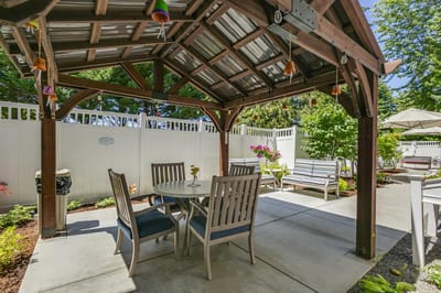 Outdoor seating area with pergola and garden