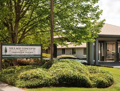 Exterior view of Village Concepts building with sign