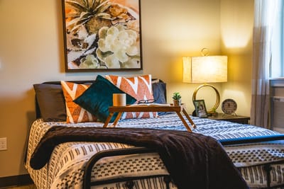 Cozy resident room with artwork and decorative pillows