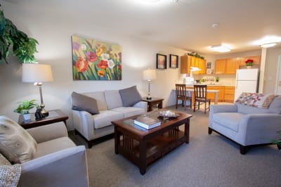 Cozy resident room with seating and kitchen area