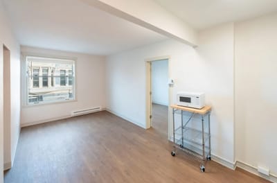 Empty interior room with a window and microwave