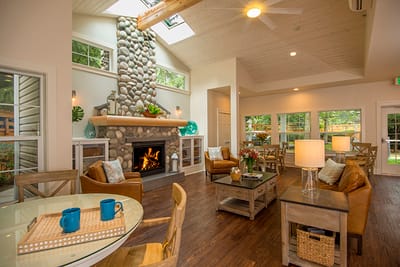 Bright common area with seating and a fireplace