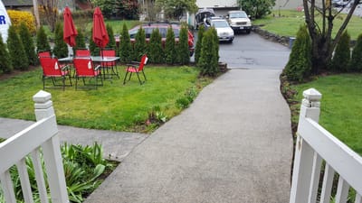 Seating area with red umbrellas and chairs in a garden
